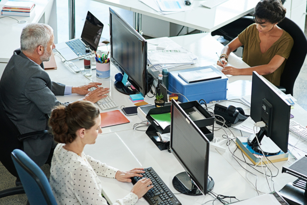 People using computers in an office
