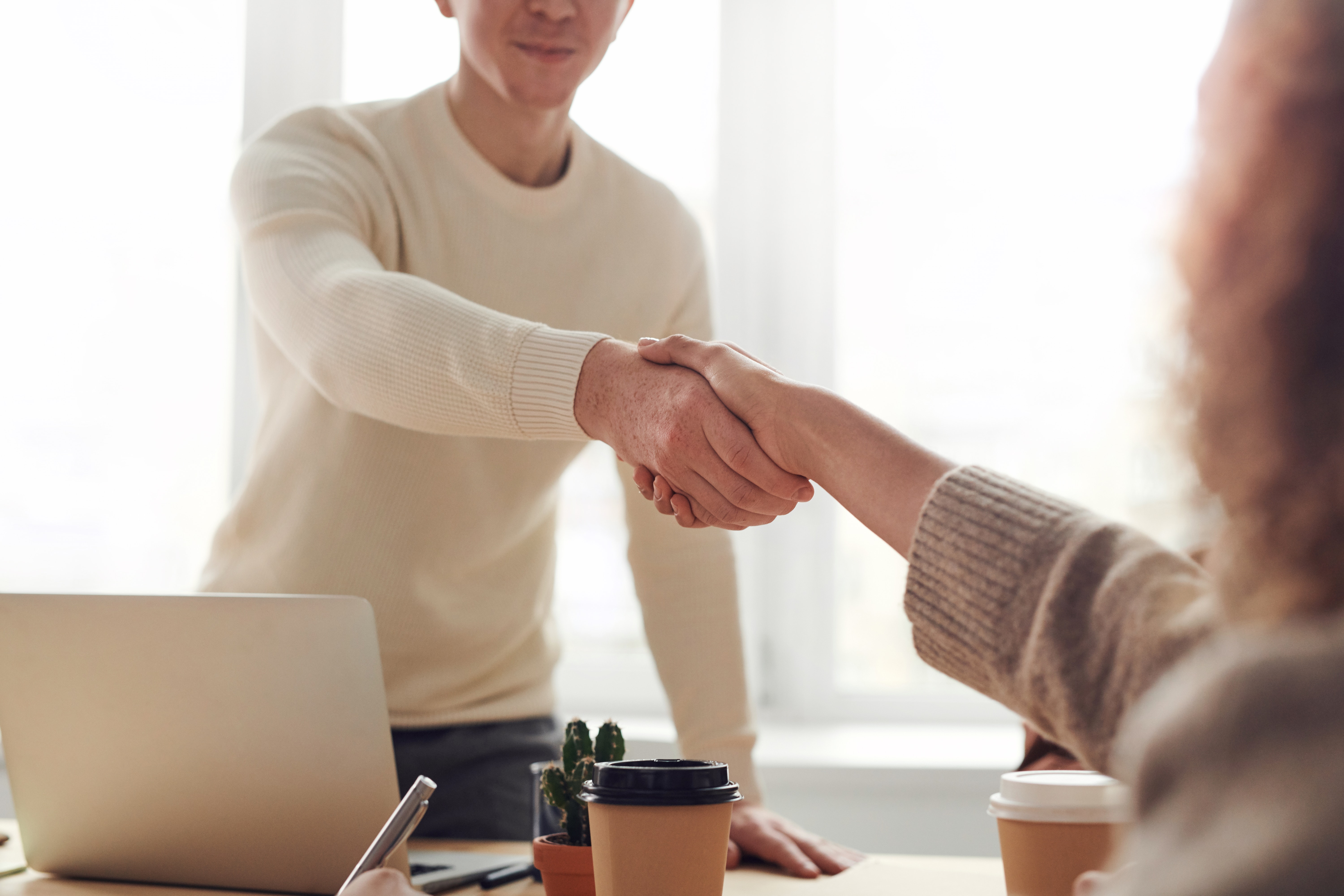 Picture of man shaking woman's hand