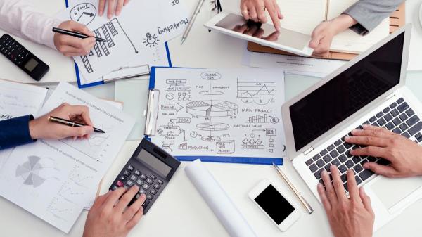 Businesspeople working on report